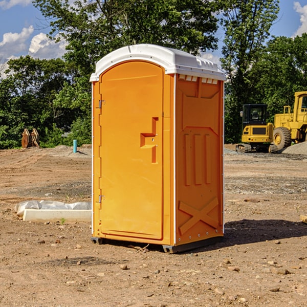 what is the cost difference between standard and deluxe portable restroom rentals in Olmsted